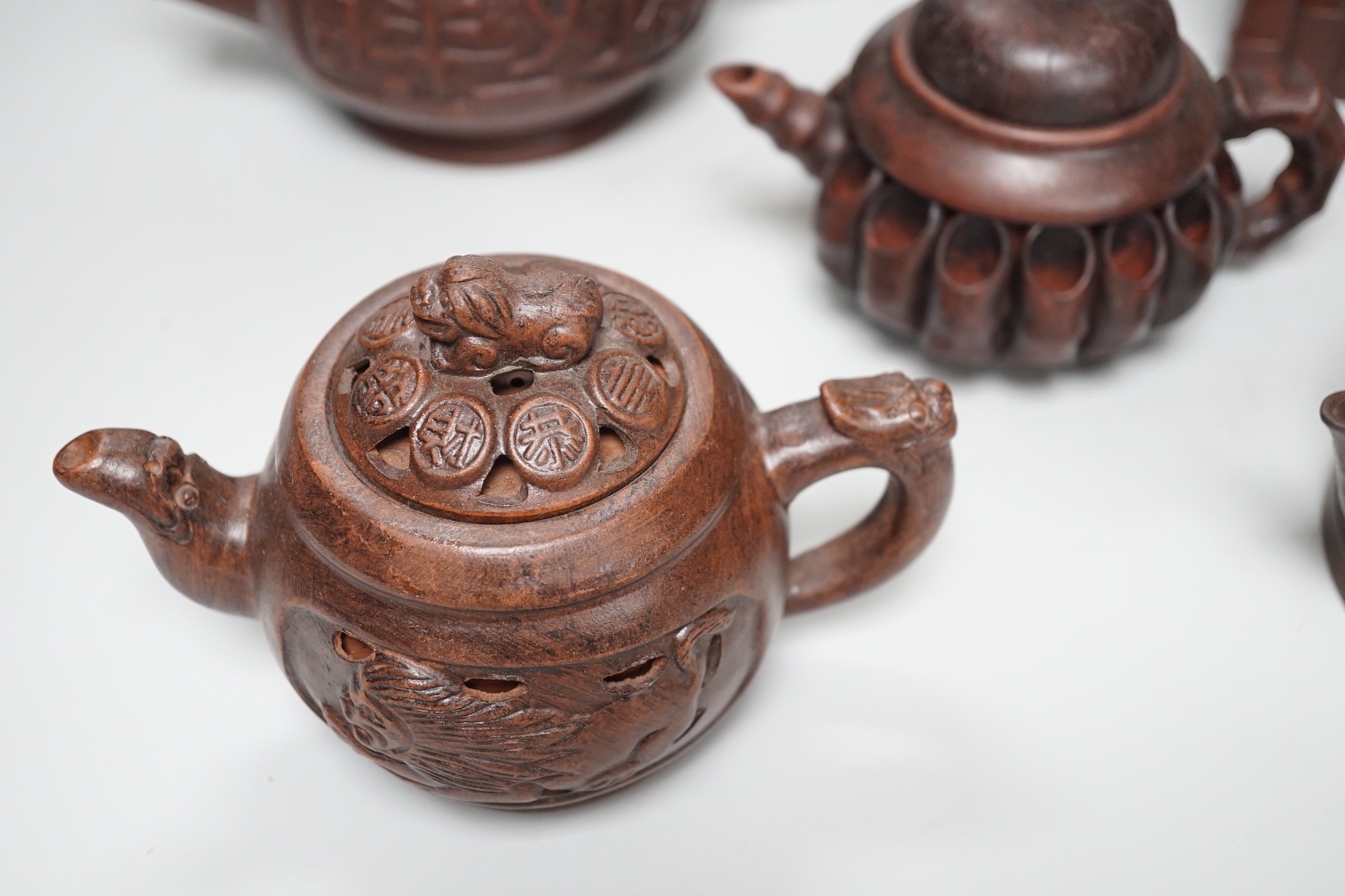 A collection of five Chinese Yixing teapots, tallest 6.5cms high